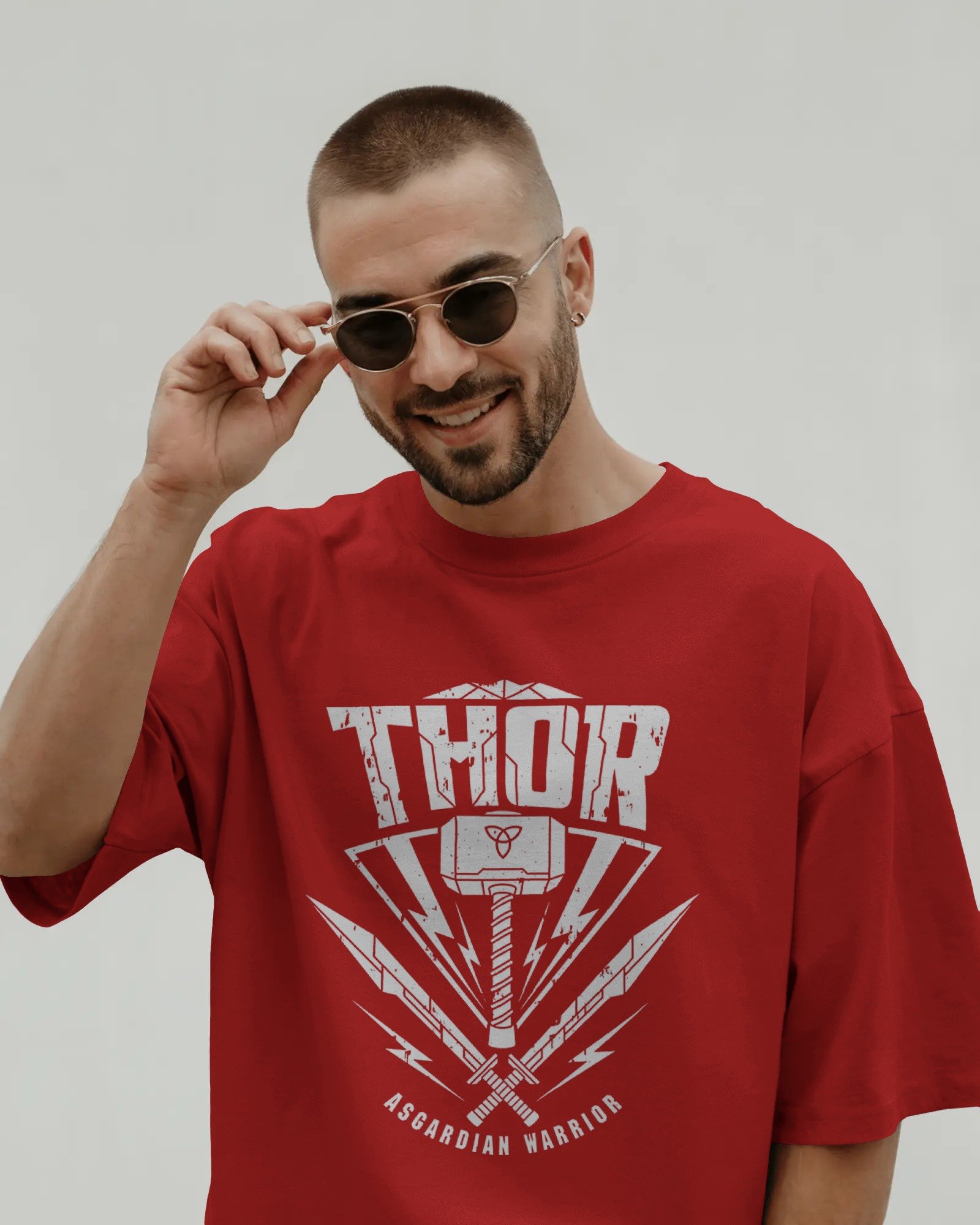 smiling-male-model-in-t-shirt-mockup-adjusting-sunglasses-on-clean-background-modern-stylish-look-02103